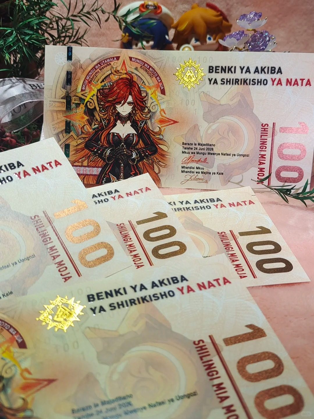Spread of Mavuika collector notes fanned out, showing the hand-drawn Pyro Archon of Natlan art and Nahuatl & Swahili lettering