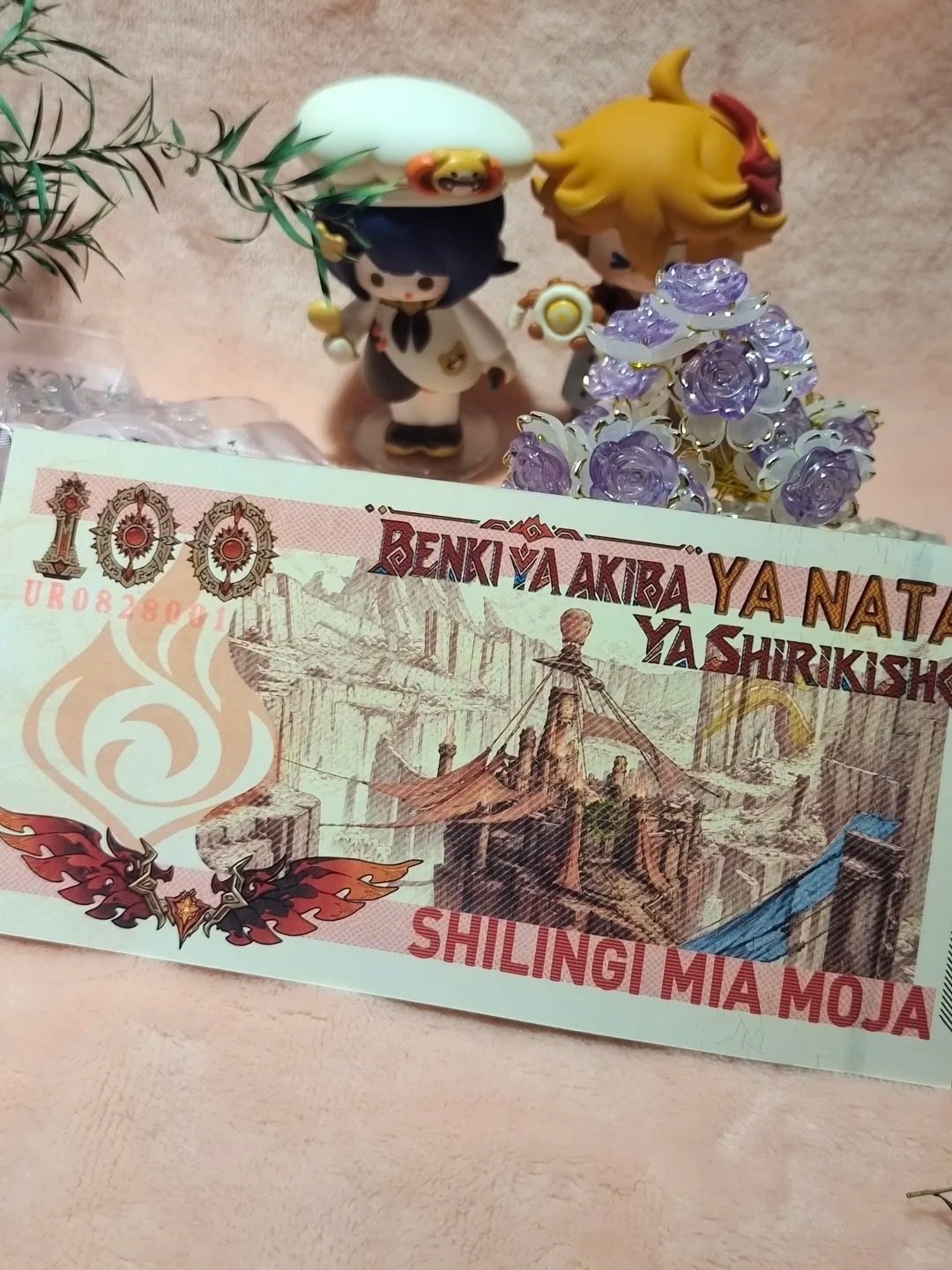 Mavuika collector note displayed with a Mavuika figure — hand-drawn collector edition